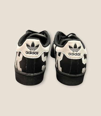Sneakers adidas superstar Nera scritta Bianca